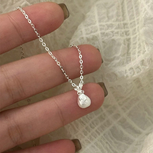 F廠【DQ1076N】S999純銀國風拉絲小福袋項鍊女精緻設計感蝴蝶結錢袋鎖骨鏈潮
 25.09-1