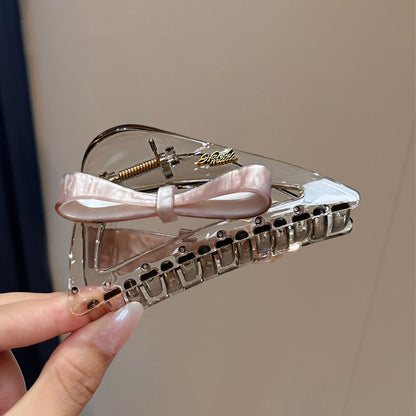 C廠【X758】韓國蝴蝶結三角抓夾女高級感鏤空壓克力鯊魚夾後腦勺盤髮通勤髮夾
 26.08-4「C廠-單筆結帳需滿，NT$500出貨(不含運費)」