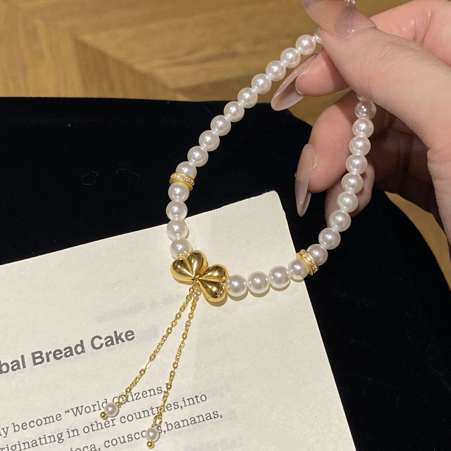 F廠【XDQ0120S】高級感小眾仿珍珠手串女S925純銀屁桃蝴蝶結流蘇手環手飾
 25.11-1