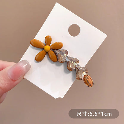 C廠【X129】韓系黃色花朵鴨嘴髮夾閃亮愛心鑽可愛百搭精緻鴨嘴夾髮飾甜美小花
 26.04-3