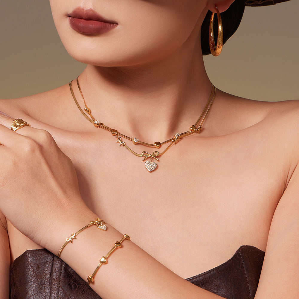 B廠【TXP499】不銹鋼蝴蝶結愛心鋯石滿鑽吊墜刀片鍊手鍊項鍊首飾組鍍18k真金
 25.11-4