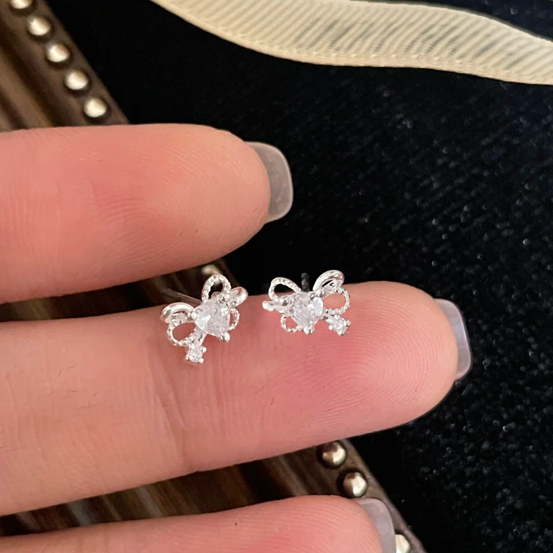 E廠【XDQ10188E】S999純銀簡約小巧蝴蝶結愛心耳環女精緻感小眾心形閃鋯耳飾潮
 25.12-1