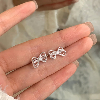 E廠【XDQ10642E】S925純銀韓版ins蝴蝶結耳環女冷淡風不規則感繩結精緻耳飾潮
 26.01-1